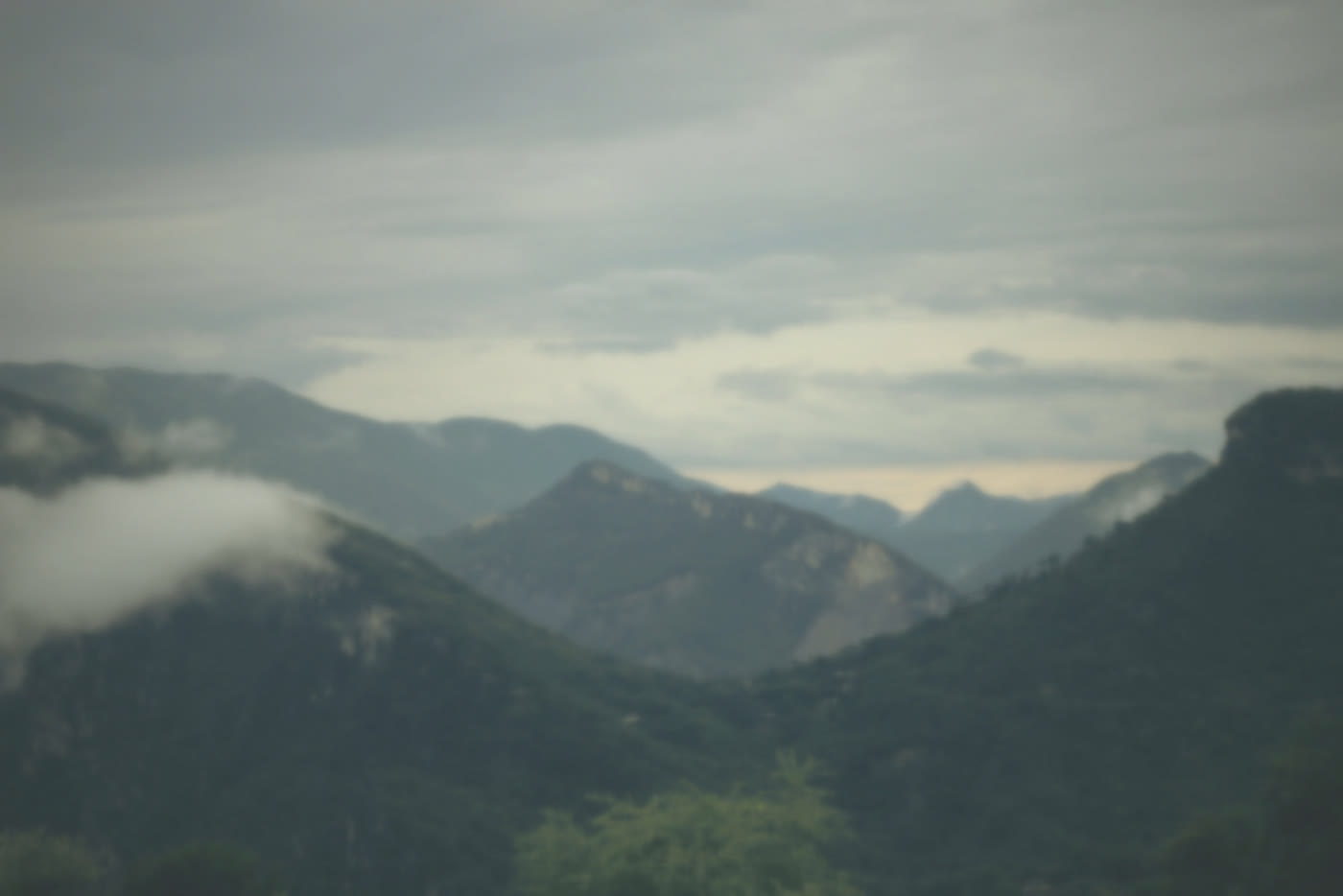 Mountain ridges in soft morning mist